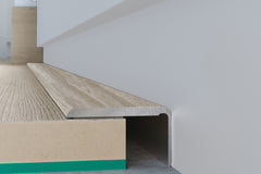 Self adhesive floor trim