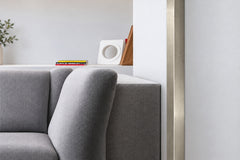 metallic grey corner trim with brushed nickel tap in modern bathroom