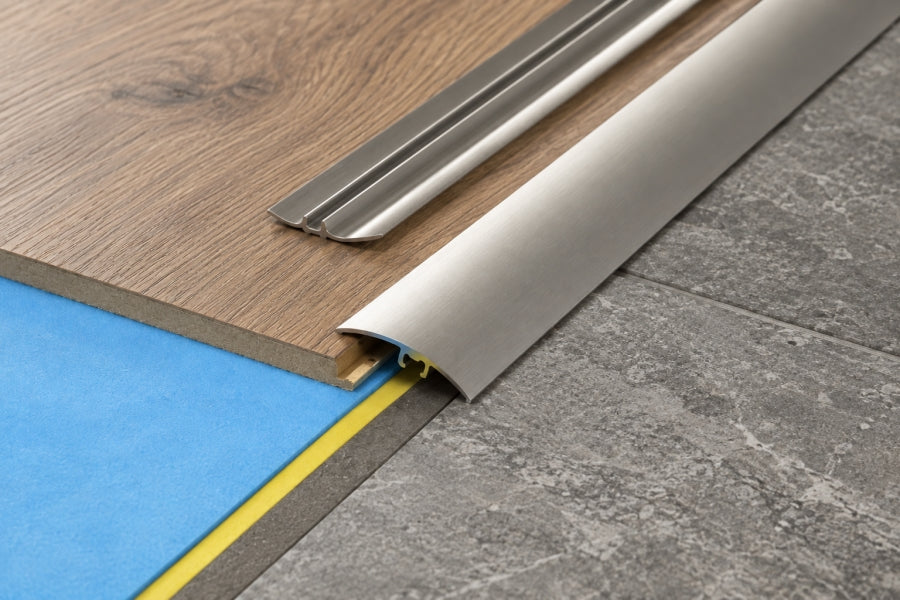 Aluminium door threshold strip cut to length with a fine tooth hacksaw