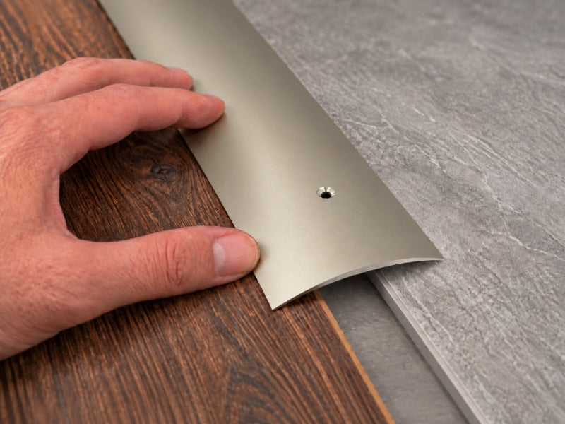 Aluminium threshold bar 70mm wide with pre-drilled screw holes, titanium finish