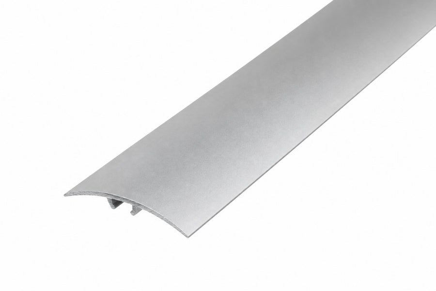 Silver anodised aluminium door threshold strip, push-in transition bar for a doorway