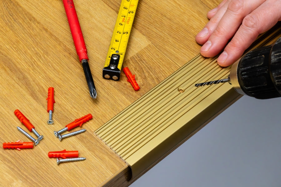 Pre-drilled countersunk holes on stair nosing strip